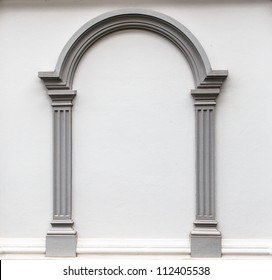 Arch Molding Decorates On The Plain Concrete Wall.