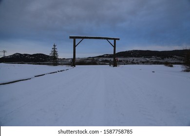 Arch Over Snow Covered Wyoming Ranch Road 