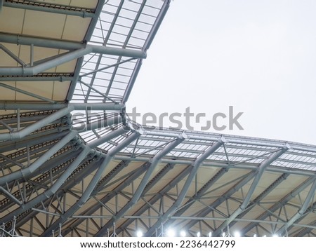 Arch of the stadium. Engineering design. Part of the roof of the stadium. Rain canopy in a modern stadium