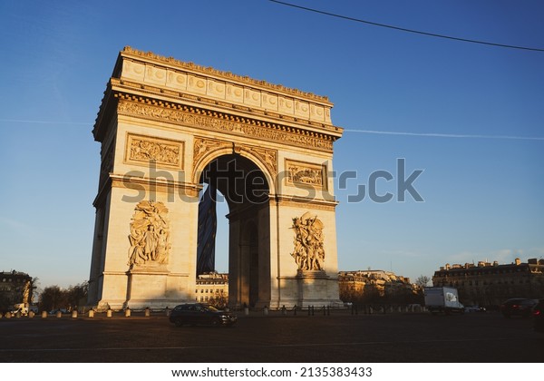 Arch of Triumph building from Paris, France,\
during a beautiful spring sunrise. Photo taken from Champs Elysee\
boulevard. Landmarks of\
France.