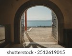 Arch View of Lake Geneva from the Nyon Castle in Nyon, Switzerland