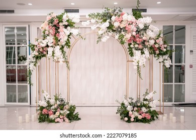 Arch for the wedding ceremony, decorated with white and pink flowers. Wedding day. - Powered by Shutterstock