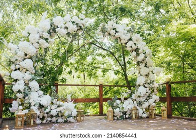 Arch with white flowers and greenery for wedding ceremony in the trend style. Beautiful wedding decoration.  - Powered by Shutterstock