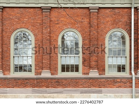 Arch windows of old brick building in Harvard University, Cambridge city, MA, USA