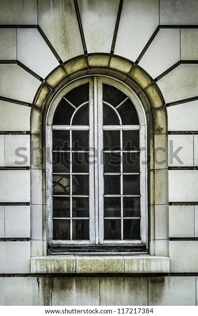  Arch wooden
window with stone rustication