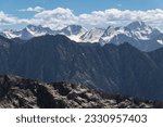 Archa Tor, Dzhilusu, Kyrgyzstan Aug 14th 2018. Views of the Tianshan mountain range with snow covered peaks with Boris Yeltsin peak in the distance in Kyrgyzstan