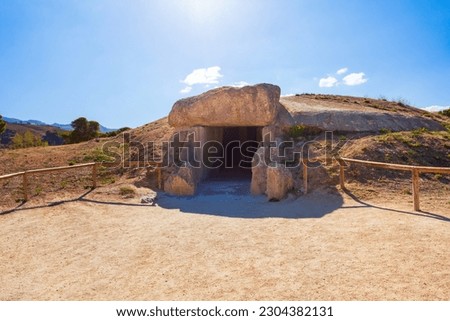 Archaeological Dolmens of Antequera. The Dolmen of Menga is a megalithic burial mound called a tumulus, a long barrow form of dolmen.