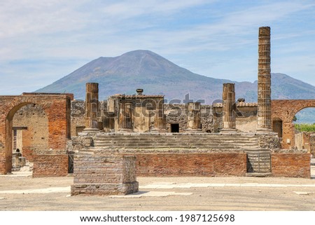 Archaeological Park of Pompeii. Temple of Jupiter with Mount Vesuvius in the background. Campania, Italy