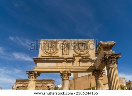 Archaeological remains of the façade of the monumental portico with attic with metopes of the old Municipal Forum of Augusta Emerita in Merida, with two medallions with the heads of Medusa, Jupiter-Am