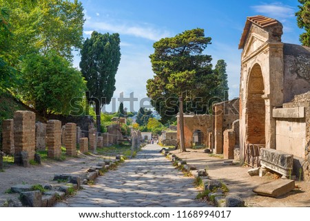 Archaeological ruin of ancient Roman city, Pompeii, was destroyed by Eruption of Vesuvius, volcano nearby city in Pompeii, Campania region, Italy. Stone street inside ruin of Pompeii roman city, Italy