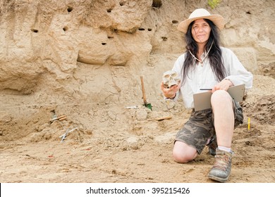 Archaeologist proudly presenting discovery at archaeological site