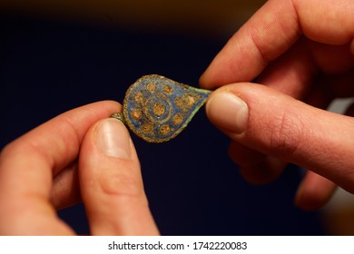 Archaeology Artefact Being Examined By An Archaeology Student,