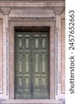 The Archbasilica of Saint John Lateran (Basilica di San Giovanni in Laterano). The main portal, bronze doors from the Curia Iulia. Lateran Basilica or Saint John Lateran. Rome, Italy