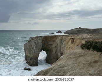 Arche de Port Blanc arch rock formation in the Atlantic Ocean on Quiberon peninsula, Portivy, Lorient, Brittany, France, July 2023 - Powered by Shutterstock