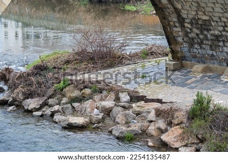 Arched brick stone bridge at the River Gardon, Ales, Occitanie, France