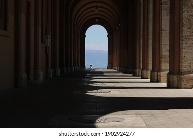 Arched columns, colonnade  with shadows in the city of Perugia 