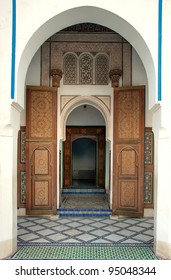 Arched Entrance To The Bahia Palace In Marrakech, With Open Ornamented Door, Morocco