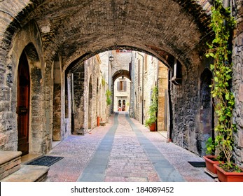 Arched Medieval Street In The Town Of Assisi, Italy