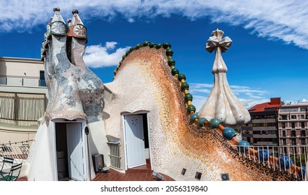 The Arched Roof And Chimney Of Casa Batllo In Barcelona, The Building, Antoni Gaudí. The Facade Is Decorated With Ceramic Mosaics.