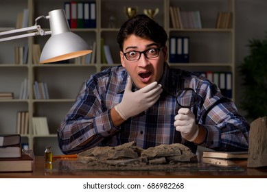 Archeologist Working Late Night In Office