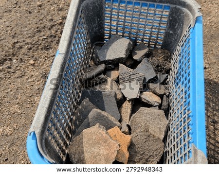 archeologists Perfect cleaning pit flat walls and bottom, which is exactly what archaeologists do with spatulas and trowels to highlight individual layers of clay stratigraphy Plastic basket: equipment every excavation site they are used store and carry finds such as pottery shards or bones