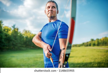 Archery. Archer Exercise With The Bow. Sport, Recreation Concept