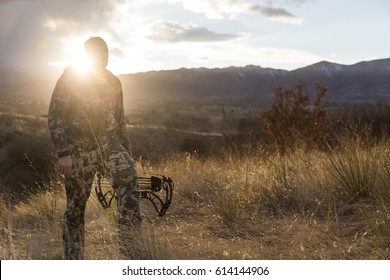 Archery hunter walking with his bow - Powered by Shutterstock