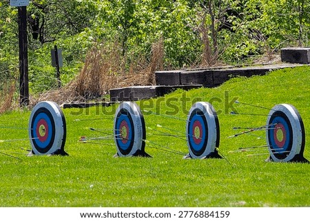 Archery target with arrows stuck in it