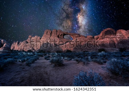 Arches National Park under a milky way star filled night sky in Moab, Utah USA.