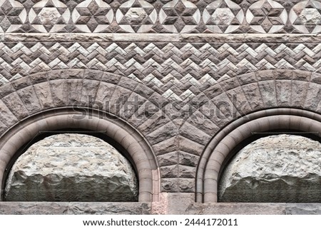 Arches in stone wall. Colonial architectural feature or detail in Old City Hall Building (1898), Toronto, Canada