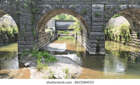 The arches within this structure become the appeal that allows pedestrians to pass across a river channel unhindered.