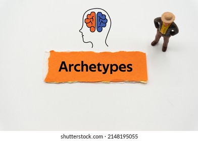 Archetypes.The word is written on a slip of colored paper. Psychological terms, psychologic words, Spiritual terminology. psychiatric research. Mental Health Buzzwords.