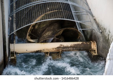 Archimedean Screw Turbine Generating Electric Energy From The Water Power Of As River. Mini Hydroelectric, Renewables