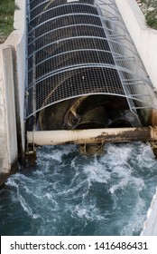 Archimedean Screw Turbine Generating Electric Energy From The Water Power Of As River. Mini Hydroelectric, Renewables