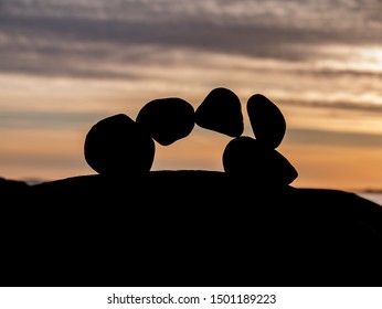 Arching rock stack in sunset