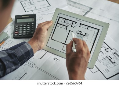 Architect Checking Final Version Of Blueprint On Tablet Screen