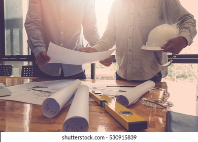 Architect concept, Architects working with blueprints in the office, Vintage Effect - Shutterstock ID 530915839