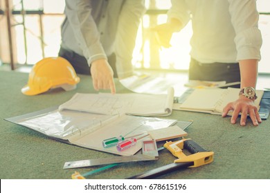 Architect, Contractor And Engineer Discuss At A Construction Site, Architecture And Engineering Concept. Tools Select Focus