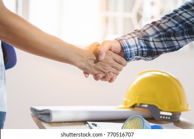 Architect Contractor Shaking Hands With Client After Seal A Deal To Renovate Building.