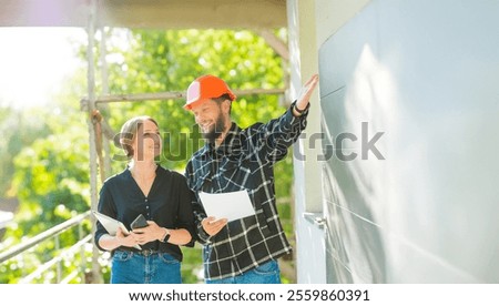 architect customer and builder worker at a construction site inspect plan check