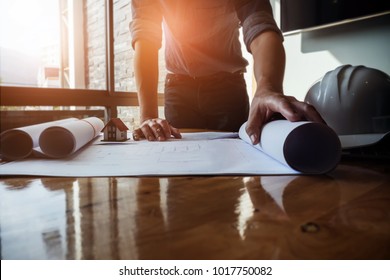 Architect design concept. Young engineer drawing of house structure on blueprint to present Customer. Engineering concept. - Powered by Shutterstock