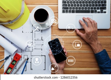 Architect design hand using smartphone with digital marketing via multi-channel communication network on mobile application technology.