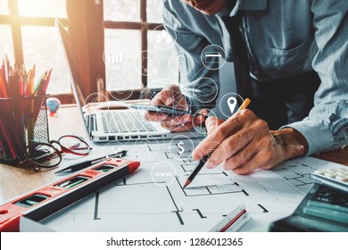 Architect design hand using smartphone with digital marketing via multi-channel communication network on mobile application technology. - Powered by Shutterstock