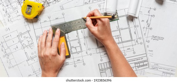 architect design working drawing sketch plans blueprints and making architectural construction model in architect studio,flat lay	