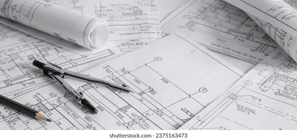 architect design working drawing sketch plans blueprints and making architectural construction model in architect studio,flat lay.	 - Powered by Shutterstock