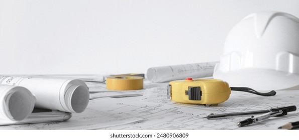 architect design working drawing sketch plans blueprints and making architectural construction model in architect studio,flat lay.