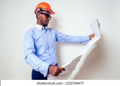 Architect Designer Black Man African American Holding Paper Drawing Template.happy African Builder Painting House,businessman Wears A Helmet Hard Hat.young Guy Is Painting Sketch Construction Plan