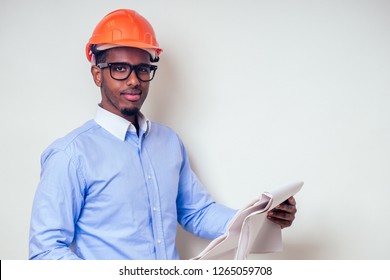 Architect Designer Black Man African American Holding Paper Drawing Template.happy African Builder Painting House,businessman Wears A Helmet Hard Hat.young Guy Is Painting Sketch Construction Plan