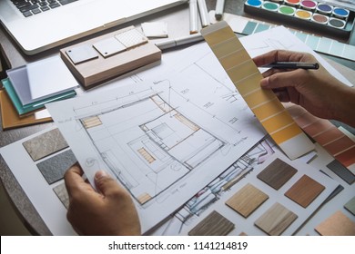 Architect designer Interior creative working hand drawing sketch plan blue print selection material color samples art tools Design Studio - Shutterstock ID 1141214819