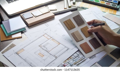 Architect designer Interior creative working hand drawing sketch plan blue print selection material color samples art tools Design Studio - Shutterstock ID 1147113635